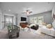 Spacious game room with a foosball table, comfortable seating, and plenty of natural light at 1012 N Sharon Amity Rd, Charlotte, NC 28211