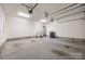 Spacious, clean two-car garage with ample room for parking and storage, including a hot water heater at 1012 N Sharon Amity Rd, Charlotte, NC 28211