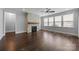 A cozy living room with a decorative stone fireplace and natural light at 1012 N Sharon Amity Rd, Charlotte, NC 28211