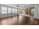 The bright living room features large windows and a sliding door with access to the outside at 1012 N Sharon Amity Rd, Charlotte, NC 28211