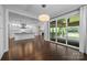 Bright living room features large windows and sliding glass doors that lead to an outdoor patio at 1012 N Sharon Amity Rd, Charlotte, NC 28211