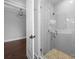 Modern glass enclosed shower with rainfall shower head and stylish tiling at 1012 N Sharon Amity Rd, Charlotte, NC 28211