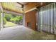 Charming sunroom with brick fireplace, natural stone floor and ceiling fan for outdoor living at 1012 N Sharon Amity Rd, Charlotte, NC 28211