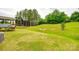 Expansive backyard featuring a grass lawn with a fence along the edge of the property at 1044 Shiloh Bend Trl, Fort Mill, SC 29715