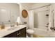 Clean bathroom featuring a tub shower, vanity with dark wood cabinet, and neutral decor at 1044 Shiloh Bend Trl, Fort Mill, SC 29715