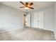 Clean, carpeted bedroom with double door closet and an open doorway to other parts of the home at 1044 Shiloh Bend Trl, Fort Mill, SC 29715