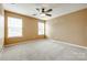 Neutral bedroom featuring a carpeted floor, ceiling fan and two windows at 1044 Shiloh Bend Trl, Fort Mill, SC 29715
