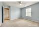 Bright bedroom with carpeted floor and neutral blue colored walls at 1044 Shiloh Bend Trl, Fort Mill, SC 29715
