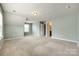 Spacious bonus room with carpet flooring and a window offering natural light at 1044 Shiloh Bend Trl, Fort Mill, SC 29715