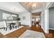 Elegant dining room with hardwood floors, white wainscoting, and modern lighting fixtures at 1044 Shiloh Bend Trl, Fort Mill, SC 29715