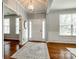 Bright foyer featuring hardwood floors, neutral walls, and modern lighting fixtures at 1044 Shiloh Bend Trl, Fort Mill, SC 29715