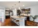Spacious kitchen with dark cabinets, granite countertops, and a large center island at 1044 Shiloh Bend Trl, Fort Mill, SC 29715