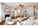Comfortable living room featuring hardwood floors, a fireplace, and neutral colors for a relaxing atmosphere at 1044 Shiloh Bend Trl, Fort Mill, SC 29715