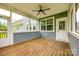A view of the spacious screened-in porch featuring natural wood flooring and bright exterior views at 1044 Shiloh Bend Trl, Fort Mill, SC 29715