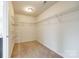 Walk-in closet with wall-mounted metal racks and carpet at 1044 Shiloh Bend Trl, Fort Mill, SC 29715