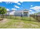 Fenced backyard features well-maintained lawn and patio, providing a private outdoor living space at 105 Chase View Ln, Troutman, NC 28166