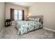 Comfortable bedroom with a bed, carpet flooring, and neutral colored walls at 105 Chase View Ln, Troutman, NC 28166