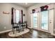 Cozy dining area featuring a modern table, chairs, and natural light from adjacent windows and doors at 105 Chase View Ln, Troutman, NC 28166