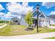 Charming home with a two-car garage, nicely landscaped front yard, and classic street lamp at 105 Chase View Ln, Troutman, NC 28166