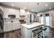 Modern kitchen features stainless steel appliances, a central island with seating, and pendant lighting at 105 Chase View Ln, Troutman, NC 28166