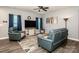 Cozy living room featuring modern furniture, a ceiling fan, and stylish decor at 105 Chase View Ln, Troutman, NC 28166