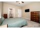 Comfortable bedroom with mounted TV, carpet floors, ensuite bath, and furnishings at 105 Chase View Ln, Troutman, NC 28166