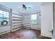A bedroom with built-in shelving and natural light at 109 N Belvedere Ave, Gastonia, NC 28054