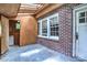 Enclosed sun room with brick accent wall and a skylight providing bright natural light at 109 N Belvedere Ave, Gastonia, NC 28054