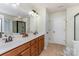 Bathroom with double sink vanity, neutral tile floor, and a separate shower at 1105 Bottle Brush Ln, Harrisburg, NC 28075