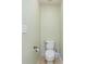 Small bathroom with tile floor, toilet, and light green walls at 1105 Bottle Brush Ln, Harrisburg, NC 28075
