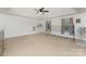 Spacious bedroom with neutral carpet, ceiling fan, and ample natural light perfect for Gathering fun at 1105 Bottle Brush Ln, Harrisburg, NC 28075