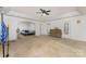 Spacious carpeted room with neutral paint, offering versatility for various uses at 1105 Bottle Brush Ln, Harrisburg, NC 28075