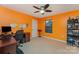 Bright bedroom features a built-in desk, ceiling fan, and ample storage space at 1105 Bottle Brush Ln, Harrisburg, NC 28075