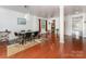 Spacious dining area features hardwood floors, modern lighting, and an open layout at 1105 Bottle Brush Ln, Harrisburg, NC 28075