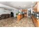 Large kitchen boasts a center island, stainless steel appliances, and an open layout to the living area at 1105 Bottle Brush Ln, Harrisburg, NC 28075
