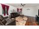 Inviting living room with hardwood floors, a fireplace, and comfortable seating at 1105 Bottle Brush Ln, Harrisburg, NC 28075