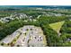 Sprawling aerial shot of a community dotted with homes and lush green trees at 12407 Crowley Ct, Charlotte, NC 28277