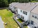 Aerial view of fenced backyards with patios, furniture, landscaping and green space at 12407 Crowley Ct, Charlotte, NC 28277