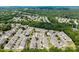 Expansive aerial view of homes nestled in a lush, green neighborhood with mature trees at 12407 Crowley Ct, Charlotte, NC 28277