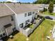 Aerial view of a townhouse with a fenced backyard, patio and green lawn at 12407 Crowley Ct, Charlotte, NC 28277