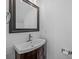 Cozy bathroom featuring a new vanity with a dark wood cabinet and custom mirror at 12407 Crowley Ct, Charlotte, NC 28277