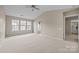 Bright bedroom with an ensuite bathroom and plenty of natural light from large windows at 12407 Crowley Ct, Charlotte, NC 28277