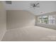 Spacious bedroom with vaulted ceilings, a ceiling fan, and large windows providing natural light at 12407 Crowley Ct, Charlotte, NC 28277