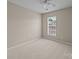 Bedroom with neutral color palette and natural light from a window at 12407 Crowley Ct, Charlotte, NC 28277