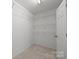 Walk-in closet with adjustable shelving for optimal storage and organization at 12407 Crowley Ct, Charlotte, NC 28277