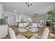 Open-concept dining area connecting to the kitchen and living room with hardwood floors at 12407 Crowley Ct, Charlotte, NC 28277