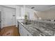 Kitchen boasts granite countertops, stainless steel appliances, and ample counter space at 12407 Crowley Ct, Charlotte, NC 28277