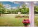 Beautiful backyard with a garden, shed, mature trees, and a trampoline at 130 Bay Laurel Dr, Mooresville, NC 28115