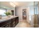 Stylish bathroom features dual sinks, dark wood cabinets, and a separate bathtub at 130 Bay Laurel Dr, Mooresville, NC 28115