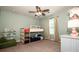 Bright bedroom with a bunk bed, fan, large window, and green walls at 130 Bay Laurel Dr, Mooresville, NC 28115